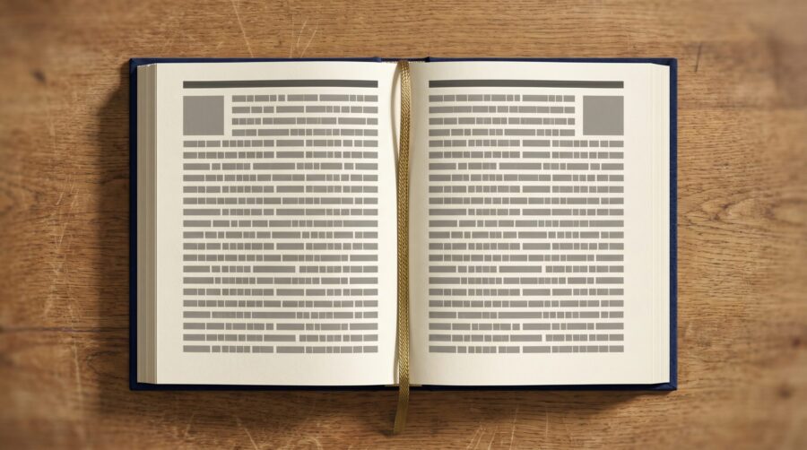 Open book showing running headers and page numbers at the top of each page in a print book interior