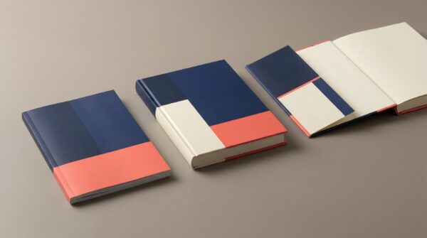 Print-on-demand book binding: a paperback, a case laminate hardcover, and an open dust jacket hardcover side by side