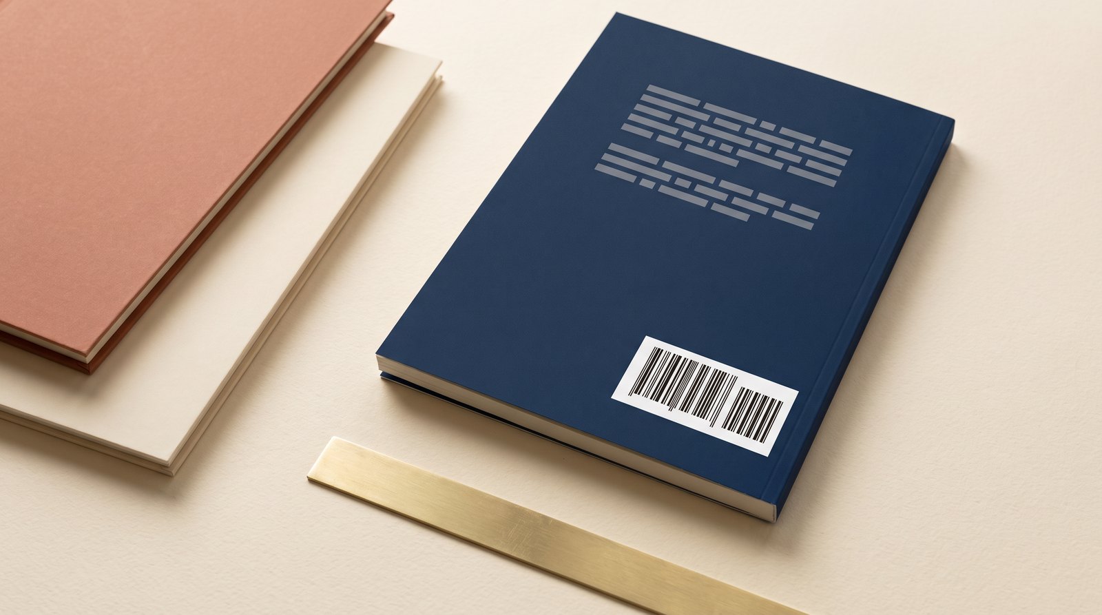 Back cover of a navy paperback showing the ISBN barcode block, with two plain paperbacks stacked alongside